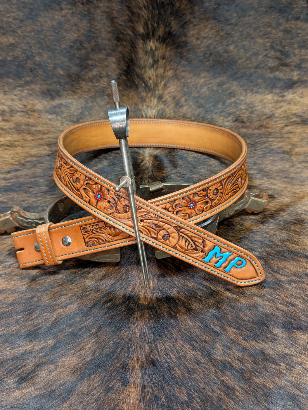 Floral carved belt with turquoise painted MP initials