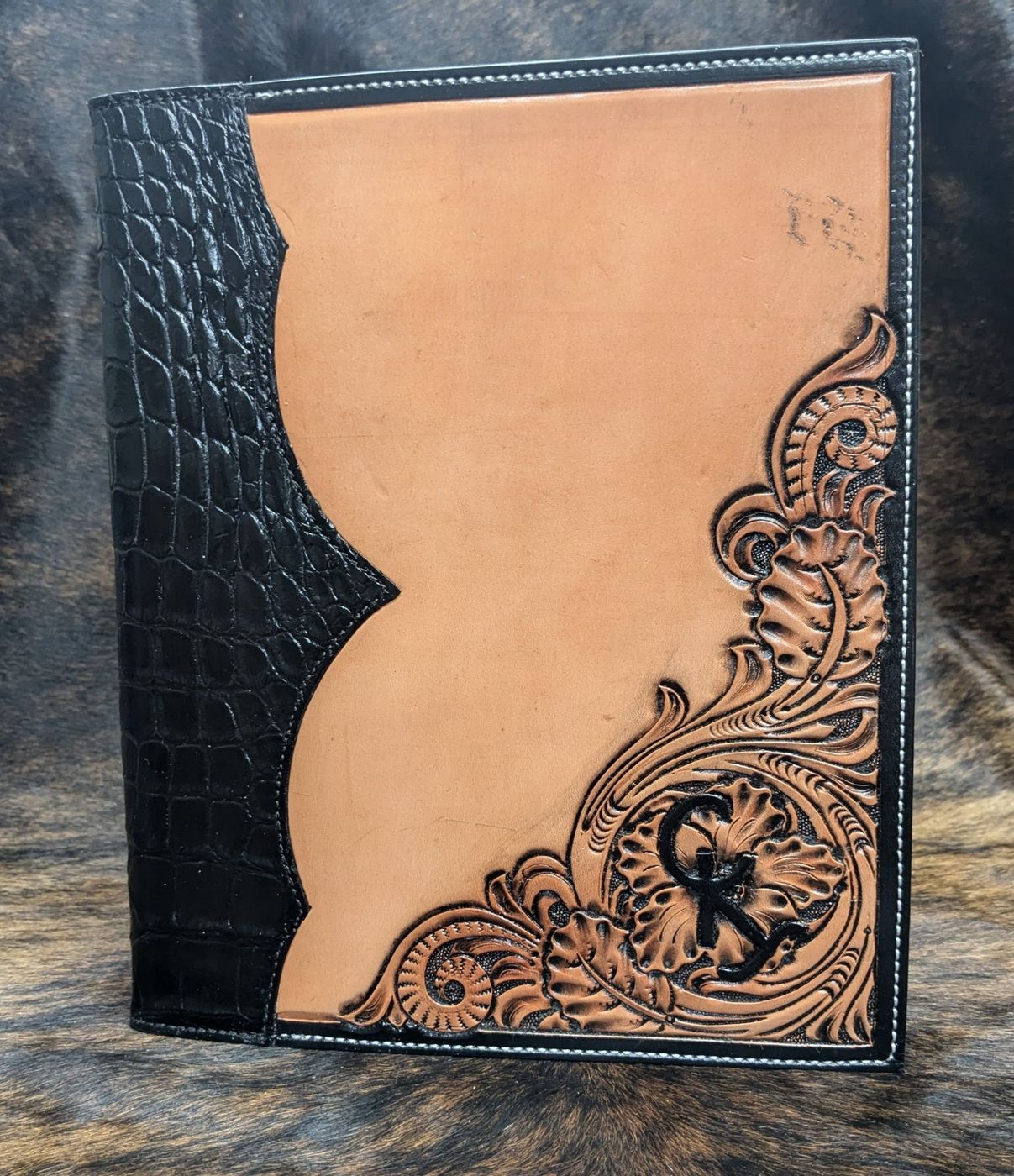 Tooled leather padfolio with black gator spine and K brand