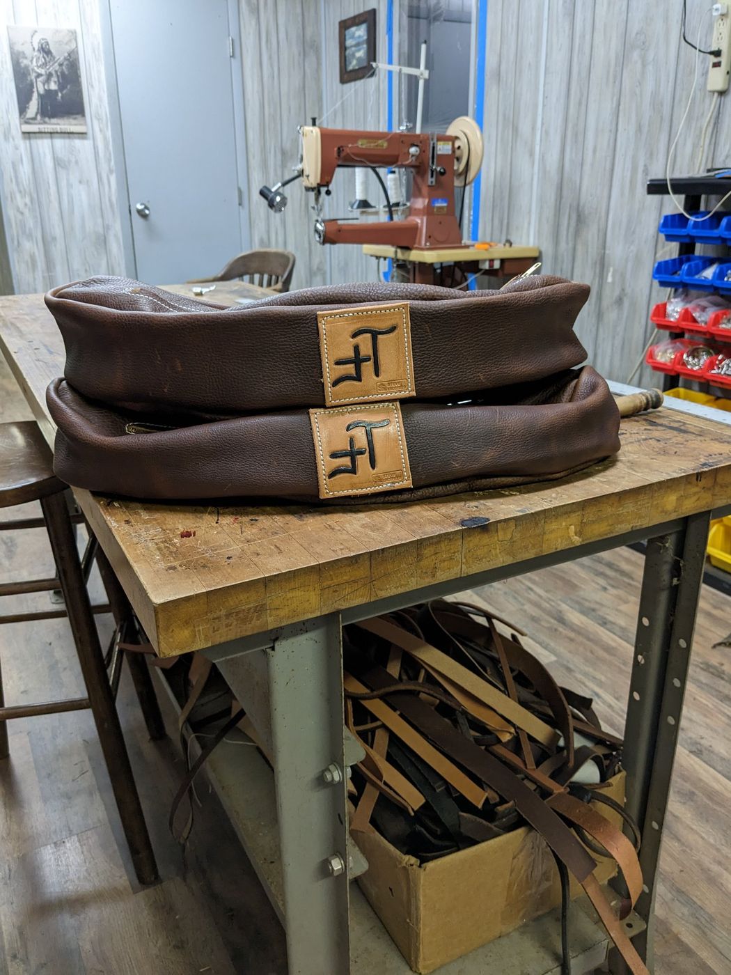 Brown leather saddlebags with brand patches